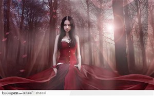 树林里坐在地子上红衣的美女