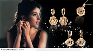 带耳环的西方美女和黑色背景上金色钻石耳环项链