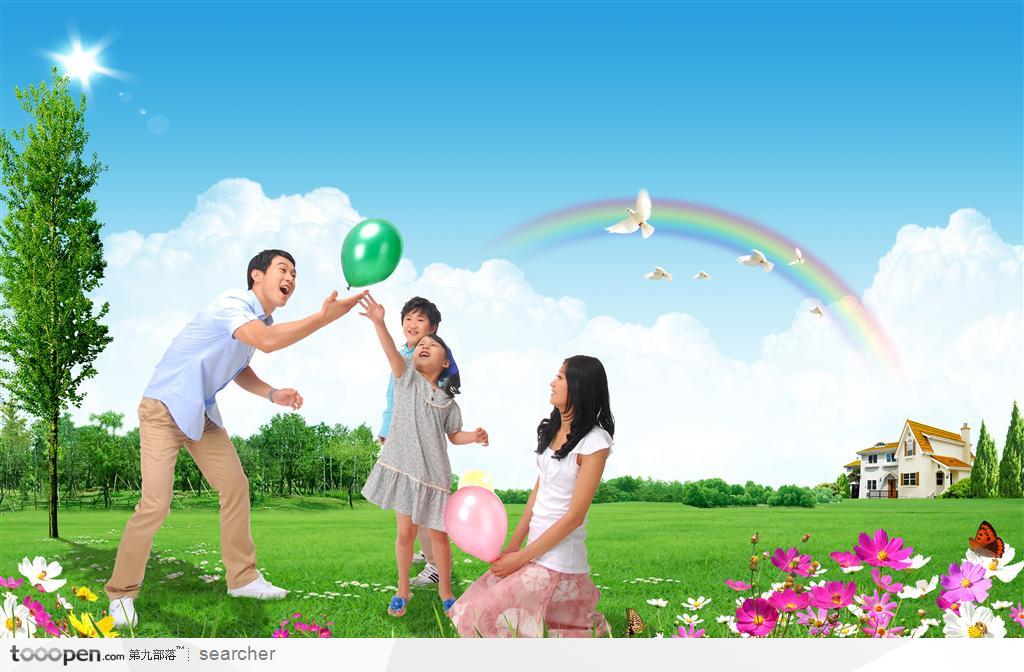 在别墅草坪前玩气球的幸福家庭