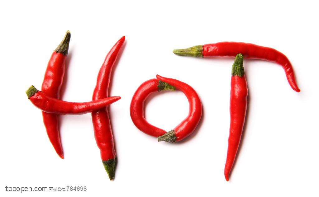 新鲜蔬菜-摆放成一个“热”的英文字母的尖辣椒蔬菜图片