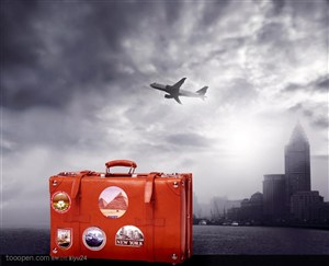 航天运输-城市上空飞翔的飞机红色旅行箱